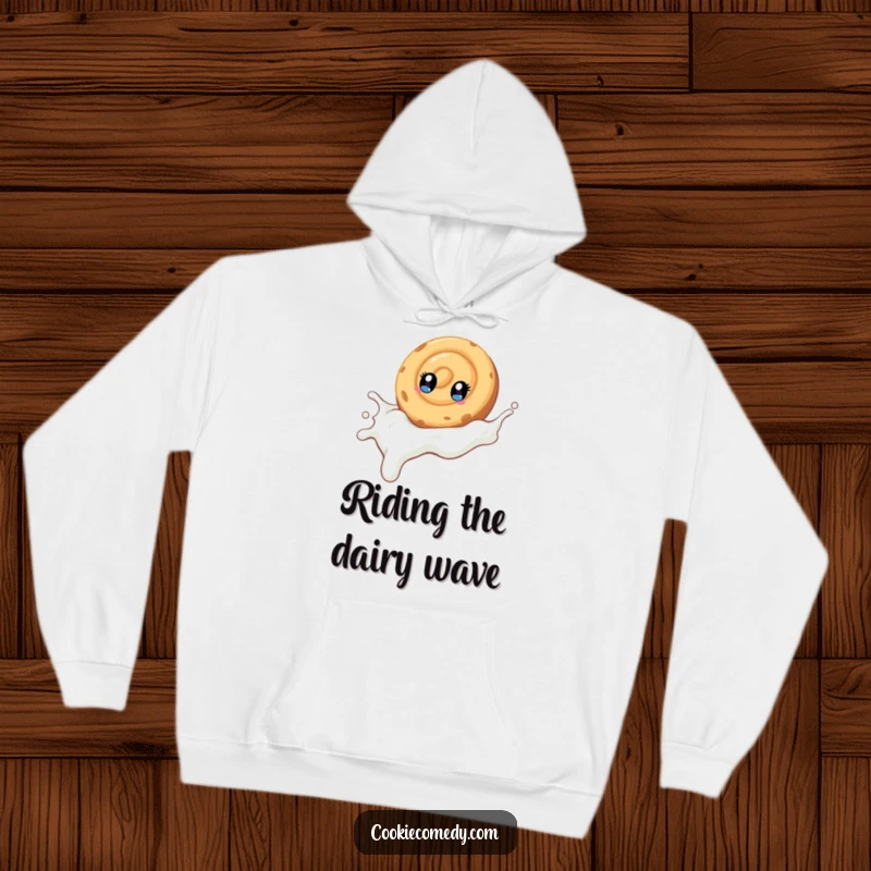 Funny hoodie design featuring a swirled cookie character with bright eyes sliding happily down a stream of milk, cozy and amusing.
